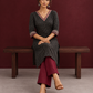 Classic Black Polka Dot Kurta with Contrast Zig-Zag Ajrakh V-Neck With Ajrakh Border On Cuffs — seated