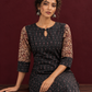 Timeless Black Ikat Cotton Kurta with Contrast Kalamkari Print Sleeves & Keyhole Neckline — seated detail