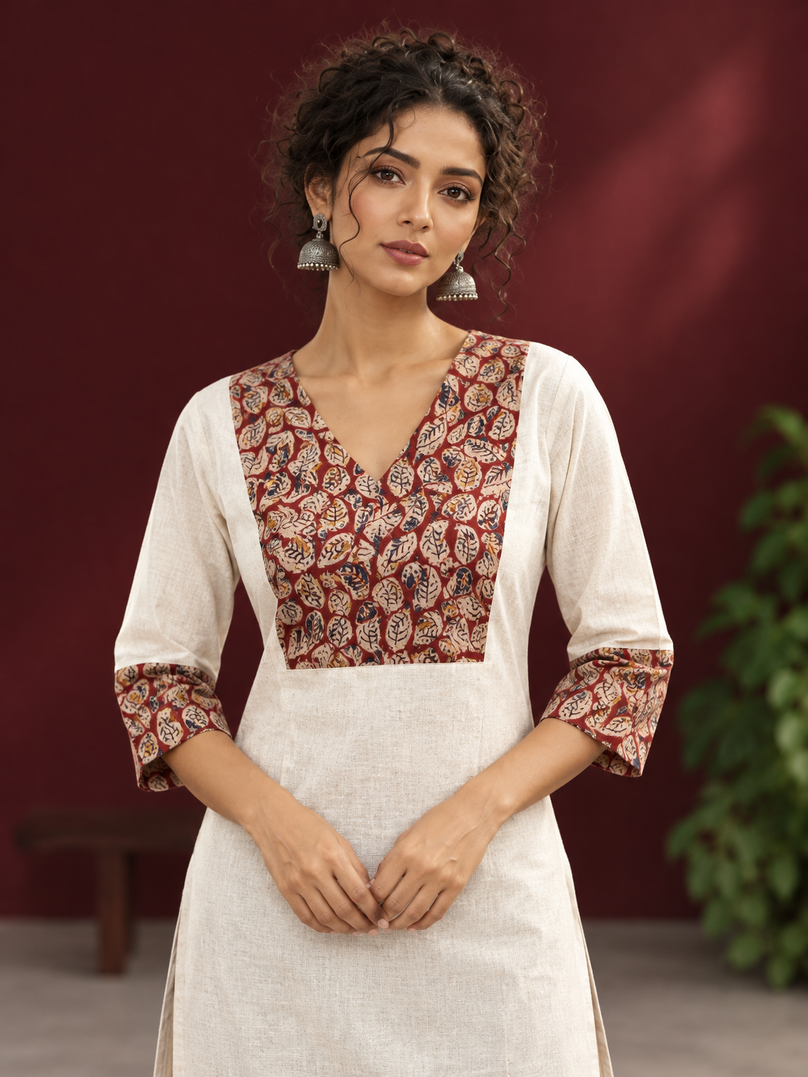 Elegant Off-White Cotton Kurta with Kalamkari Leaf Print Yoke and Contrast Cuffs — fabric detail