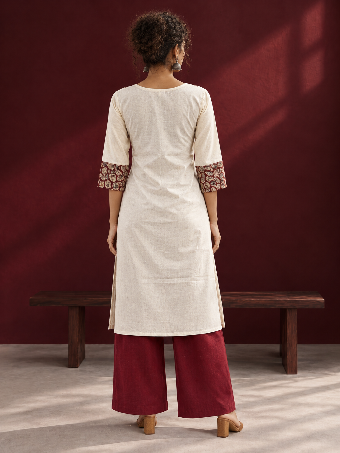 Elegant Off-White Cotton Kurta with Kalamkari Leaf Print Yoke and Contrast Cuffs — back view