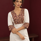 Elegant Off-White Cotton Kurta with Kalamkari Leaf Print Yoke and Contrast Cuffs — styled view