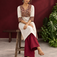 Elegant Off-White Cotton Kurta with Kalamkari Leaf Print Yoke and Contrast Cuffs — seated
