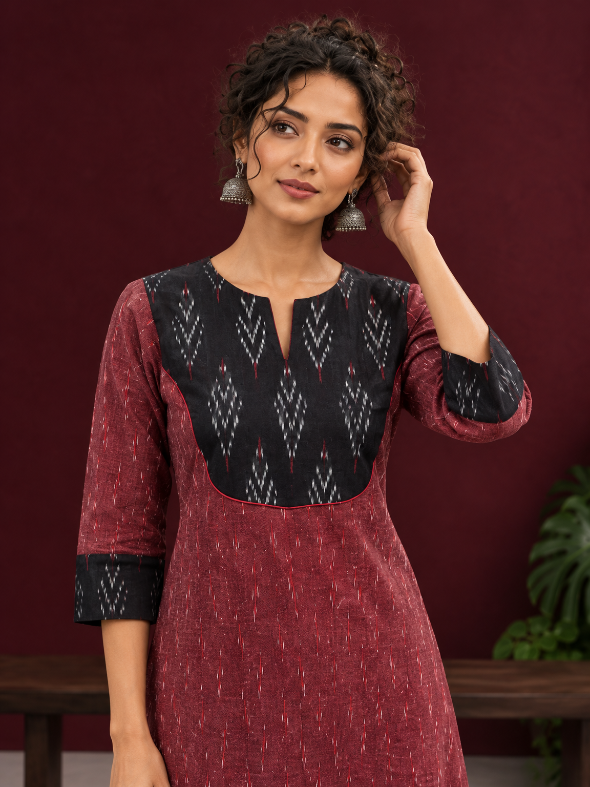 Elegant Maroon Ikat Cotton A Line Kurta With Black Yoke & Ikat Cuff Detailing — styled view