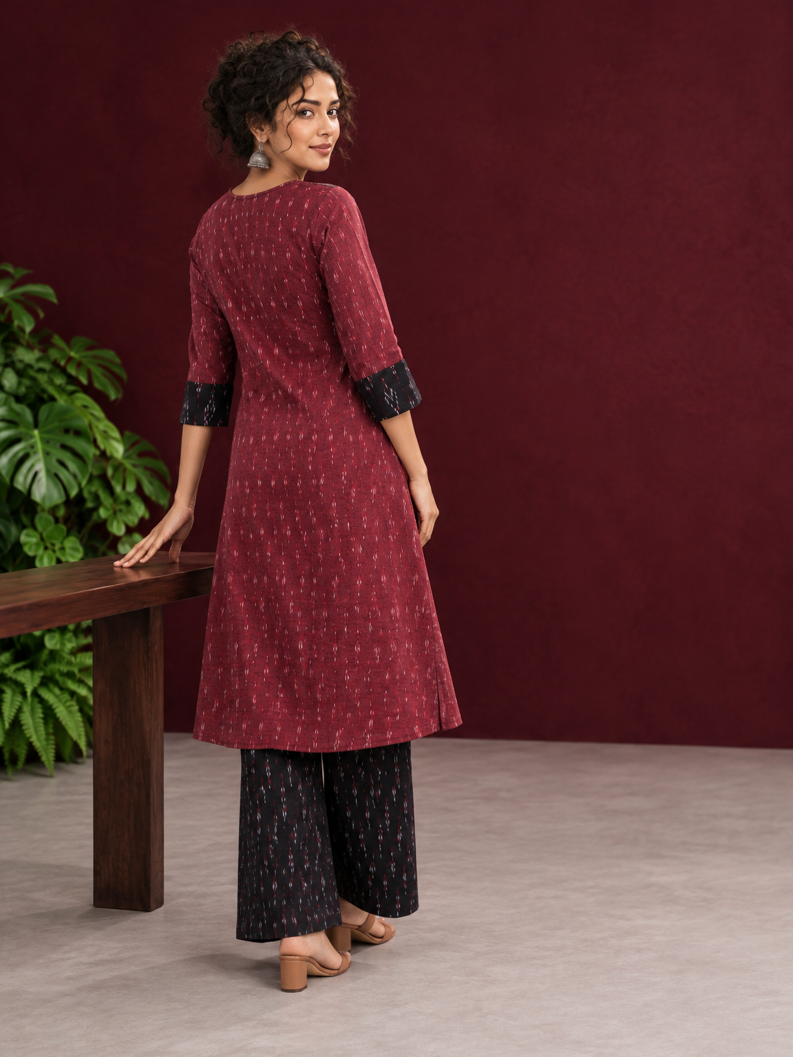 Elegant Maroon Ikat Cotton A Line Kurta With Black Yoke & Ikat Cuff Detailing — back view