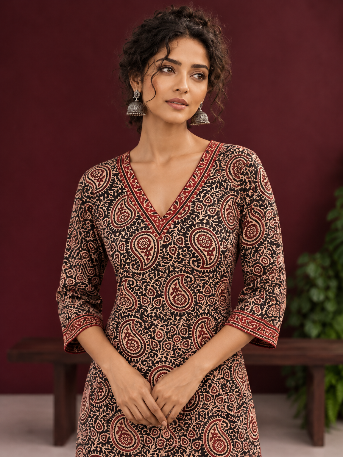 Black Cotton Ajrakh Print Kurta with Maroon Paisley Motifs and Contrast V-Neck Border — fabric detail