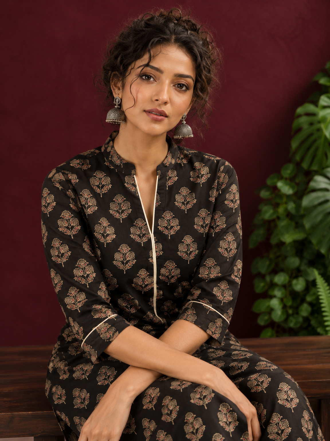 Elegant Black Cotton Kurta with Floral Block Print and Contrast Collar Piping — seated detail