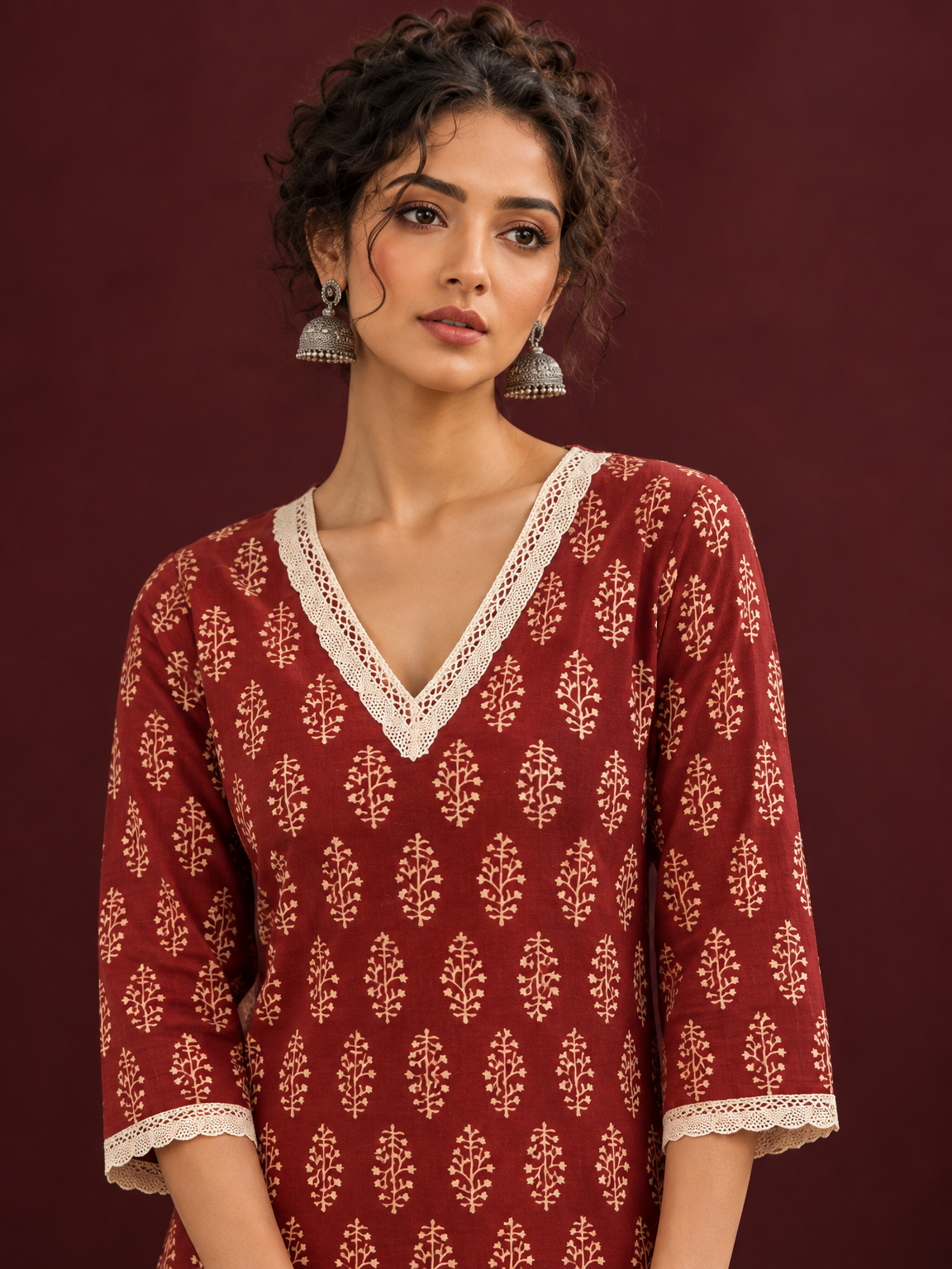 Maroon Cotton Ajrakh Kurta with Floral Motif Block Print and Crochet Lace V-Neck & Sleeve Cuffs — fabric detail