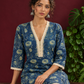 Elegant Indigo Blue Cotton Kurta with Floral Block Print and Crochet Lace V-Neck Trim — seated detail