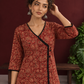 Maroon Cotton Kurta with Ajrakh Floral Print, Black Contrast Binding & Angrakha Style Wrap Front — styled view