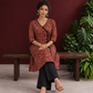 Maroon Cotton Kurta with Ajrakh Floral Print, Black Contrast Binding & Angrakha Style Wrap Front — seated