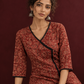 Maroon Cotton Kurta with Ajrakh Floral Print, Black Contrast Binding & Angrakha Style Wrap Front — seated detail