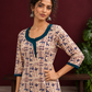 Beige Cotton Kurta with Tribal Motif Print & Contrast Teal Blue V-Neck Panel — styled view