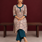 Beige Cotton Kurta with Tribal Motif Print & Contrast Teal Blue V-Neck Panel — seated