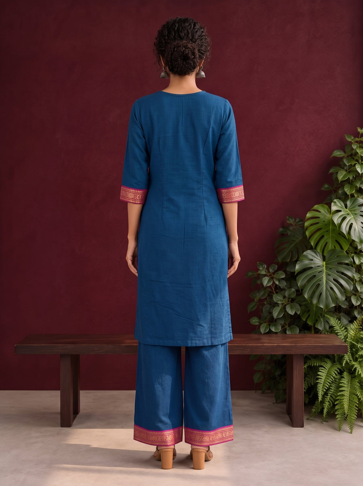 Elegant Peacock Blue Cotton Kurta with Contrast Pink & Gold Woven Border Neckline and Matching Salwar — back view