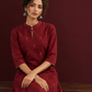 Elegant Maroon Cotton Silk Kurta with Golden Motif Print With Mandarin Collar — seated detail