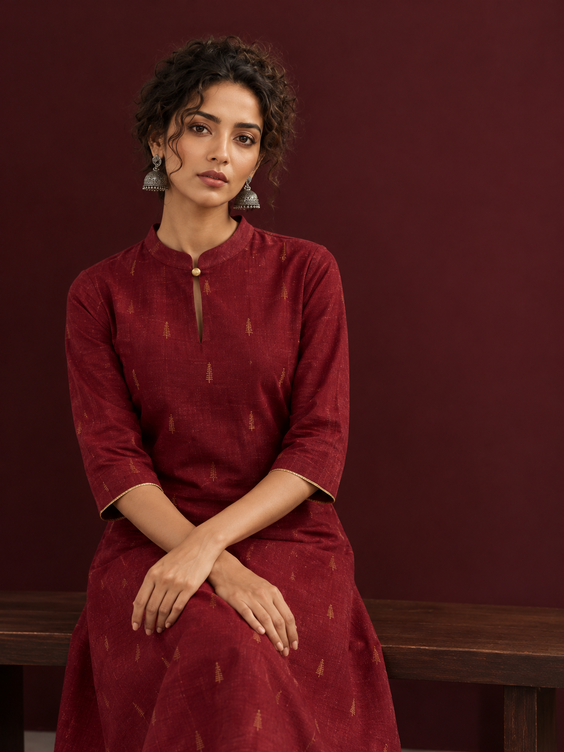 Elegant Maroon Cotton Silk Kurta with Golden Motif Print With Mandarin Collar — seated detail