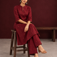 Elegant Maroon Cotton Silk Kurta with Golden Motif Print With Mandarin Collar — seated