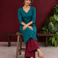 Elegant Teal Cotton Silk Kurta with Golden Motif and Notched Tulip Neckline — seated