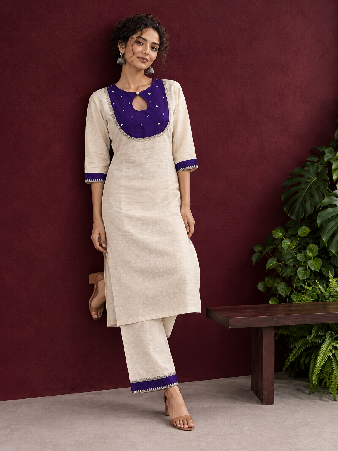 Elegant Off-White Silk Kurta with Contrast Purple Yoke Panel & Hand Embroidered Sequin Detailing — side view