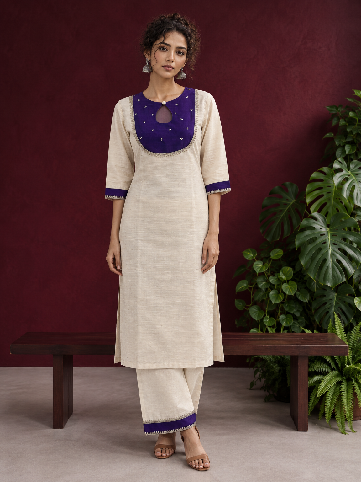 Elegant Off-White Silk Kurta with Contrast Purple Yoke Panel & Hand Embroidered Sequin Detailing — front view
