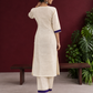 Elegant Off-White Silk Kurta with Contrast Purple Yoke Panel & Hand Embroidered Sequin Detailing — back view