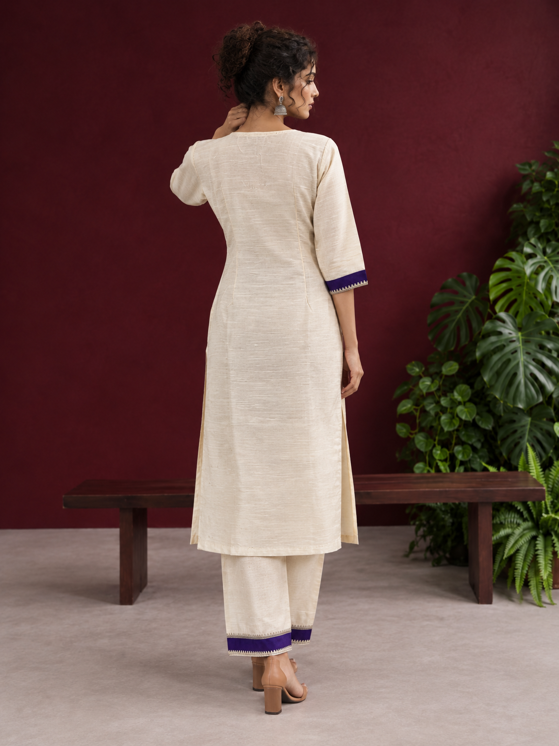 Elegant Off-White Silk Kurta with Contrast Purple Yoke Panel & Hand Embroidered Sequin Detailing — back view