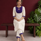 Elegant Off-White Silk Kurta with Contrast Purple Yoke Panel & Hand Embroidered Sequin Detailing — seated