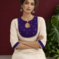 Elegant Off-White Silk Kurta with Contrast Purple Yoke Panel & Hand Embroidered Sequin Detailing — seated detail