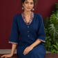 Elegant Teal Blue Rayon kurta with Contrast Kalamkari Printed Collar and Cuffs — seated detail