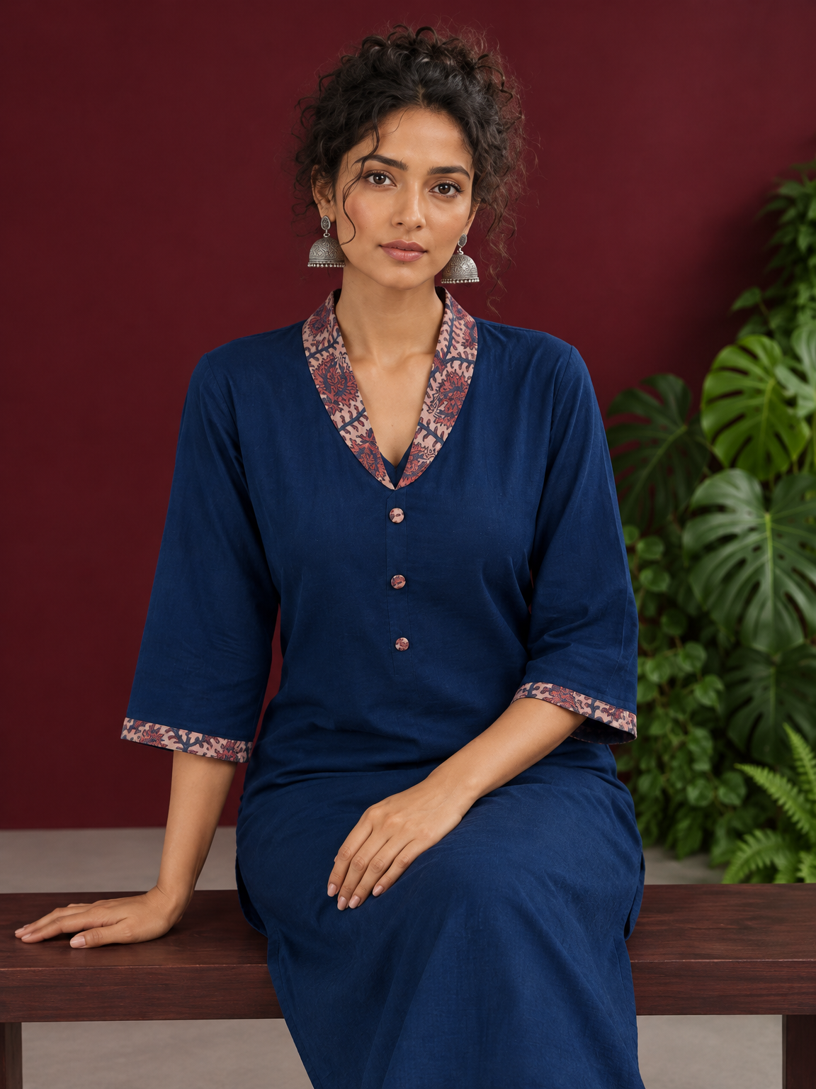 Elegant Teal Blue Rayon kurta with Contrast Kalamkari Printed Collar and Cuffs — seated detail