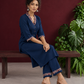 Elegant Teal Blue Rayon kurta with Contrast Kalamkari Printed Collar and Cuffs — seated