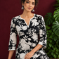 Classic Black Rayon Kurta with White Floral Print and Contrast Notched Neckline — seated detail