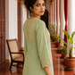 Elegant pista Green Kurta with Golden Floral brocade Yoke, appliqué Sleeve hem