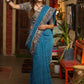 Exclusive Teal blue cotton saree highlighted with kalamkari and indigo borders