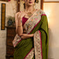 Elegant moss green cotton saree highlighted with handpainted madhubani