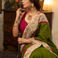 Elegant moss green cotton saree highlighted with handpainted madhubani