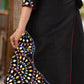 Black cotton dress with hand embroidered mirror work on sides