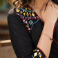 Black cotton dress with hand embroidered mirror work on sides