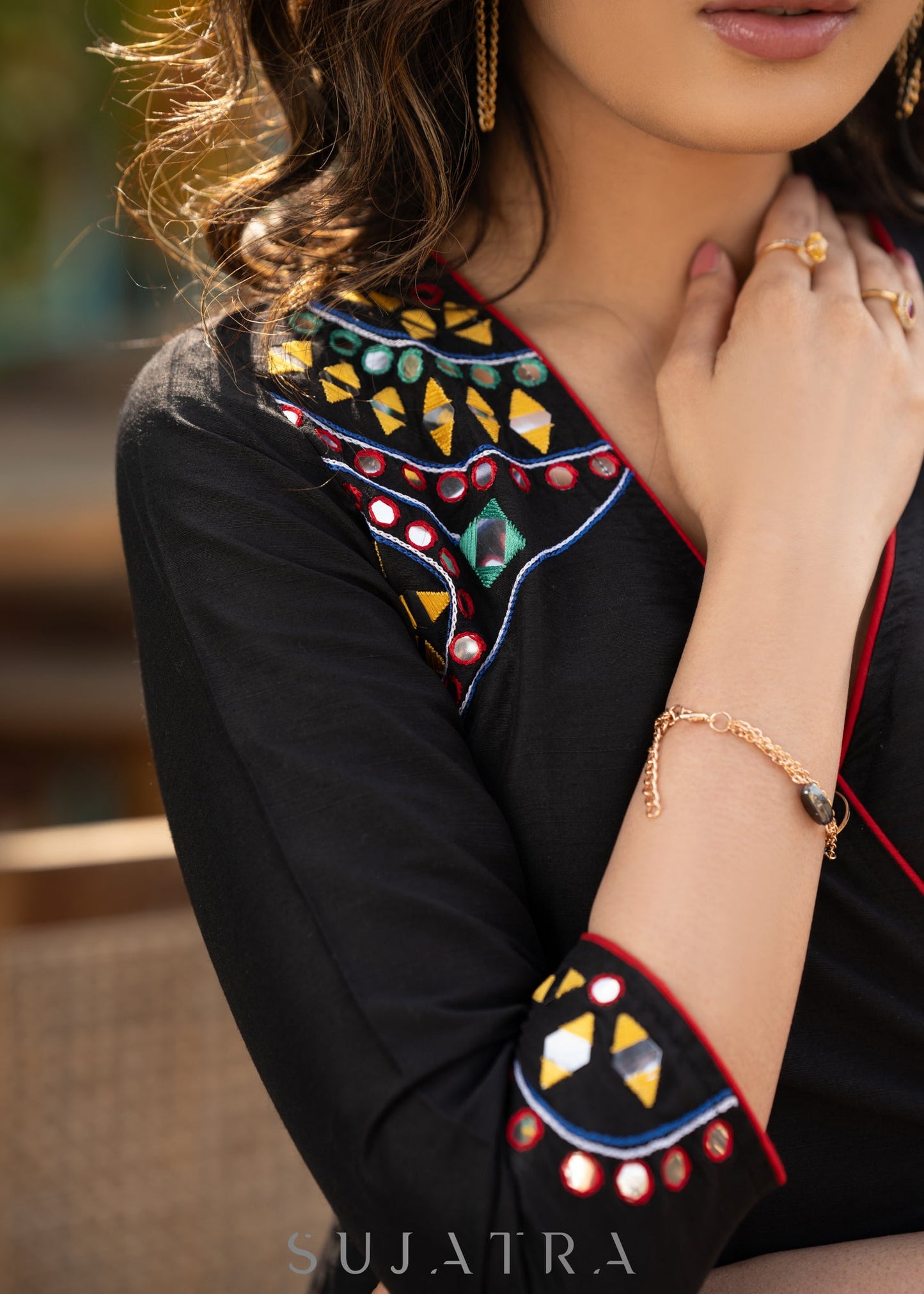 Black cotton dress with hand embroidered mirror work on sides