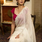 Graceful ivory organza saree with elegant floral embroidery on the border