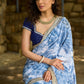 Stylish sky blue floral printed saree highlighted with sequence embroidery & contrast embroidered lace