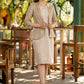 Beige blazer with striped dress