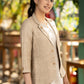Beige blazer with striped dress