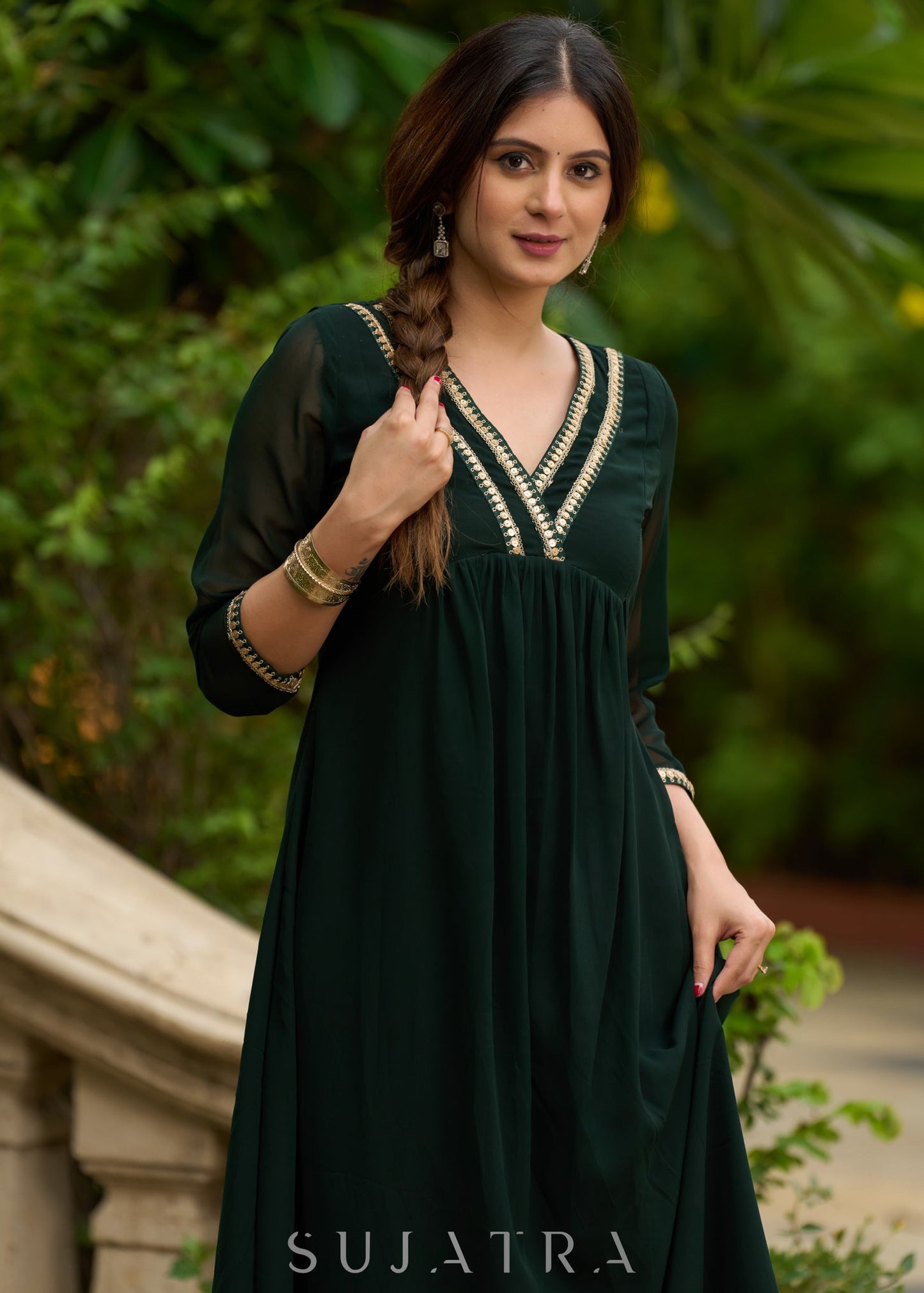 Elegance redefined in this captivating green georgette lace kurta and pant ensemble