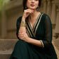 Elegance redefined in this captivating green georgette lace kurta and pant ensemble