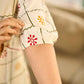 Soft off-white block printed rayon dress with intricate all-over hand block printed checks and florals, a gently gathered yoke, and rich red accents for a refined, elegant everyday look.