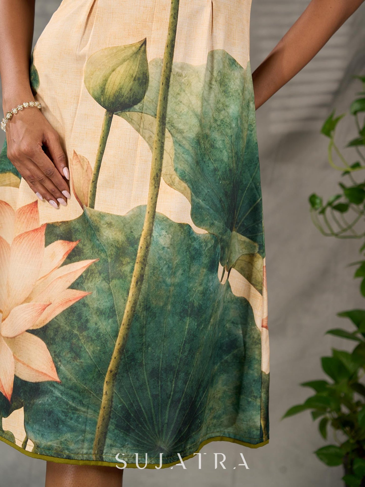 Statement Cream lotus motif dress with earthy olive accents.