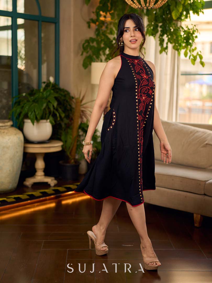 Black bias-cut block print halter dress with a red jaal hand block printed front panel, golden print detailing, and red accents for a striking, elegant statement look.