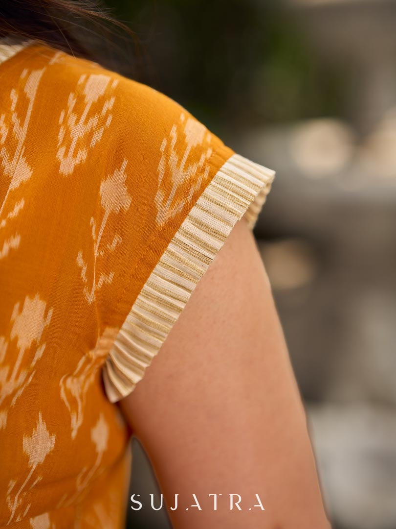 Statement mercerised mustard Ikat dress elevated with drop-shoulder styling, pleated neckline and sleeves detailing featuring soft box pleats for ease and movement