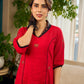 Elegant red dress featuring delicate, hand-painted Madhubani lotus motif detailing.